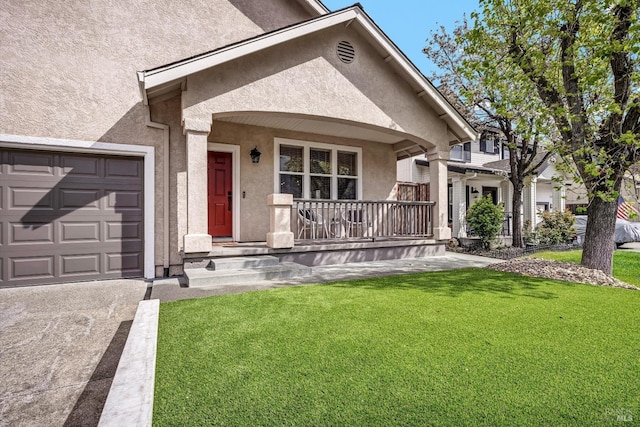 view of front of house featuring a garage, concrete driveway, a front yard, stucco siding, and a porch