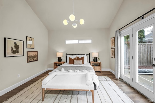 bedroom with vaulted ceiling, an inviting chandelier, baseboards, access to outside, and wood finished floors