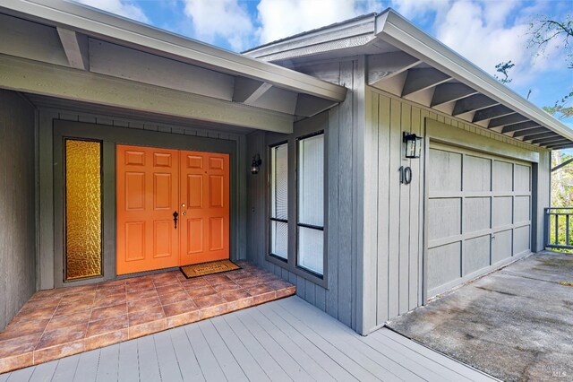 doorway to property with an attached garage