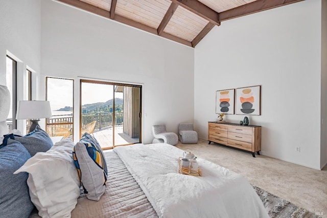carpeted bedroom featuring high vaulted ceiling, wooden ceiling, beam ceiling, access to outside, and a mountain view