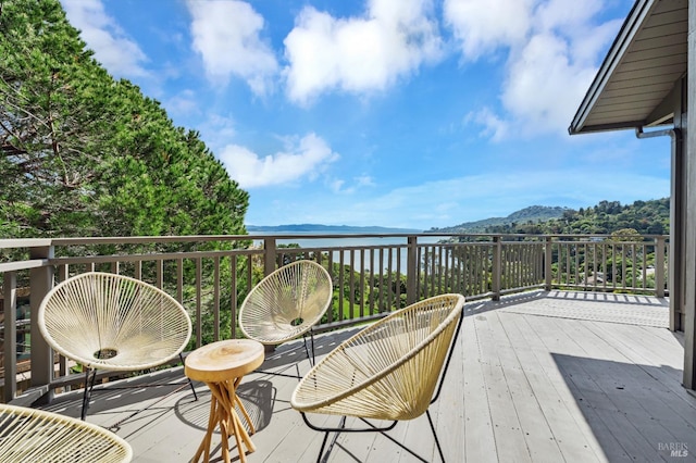 wooden deck featuring a mountain view