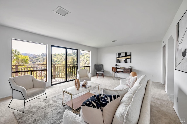 carpeted living room with visible vents