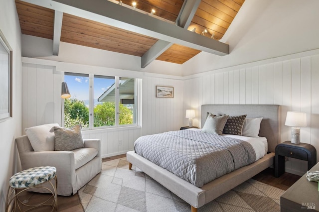 bedroom with wooden ceiling, vaulted ceiling with beams, and wood finished floors