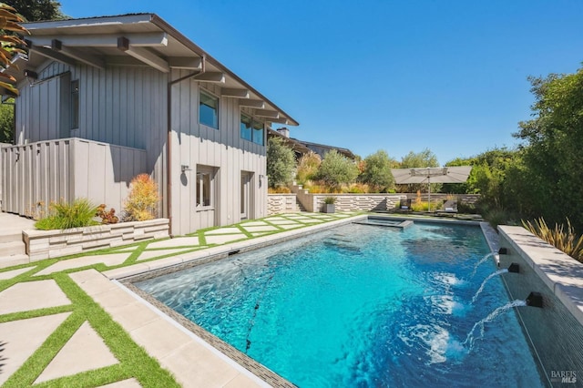 view of swimming pool featuring fence and a fenced in pool