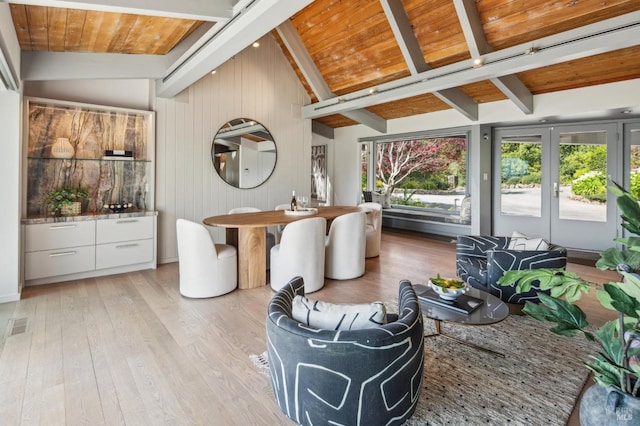sunroom / solarium with visible vents, french doors, and beamed ceiling