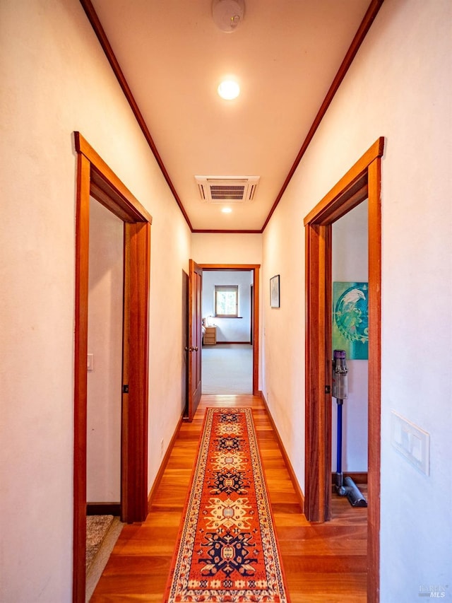 26300 Albion Ridge Rd, Albion, CA 95410 - corridor featuring light wood-type flooring, crown molding, baseboards, and visible vents