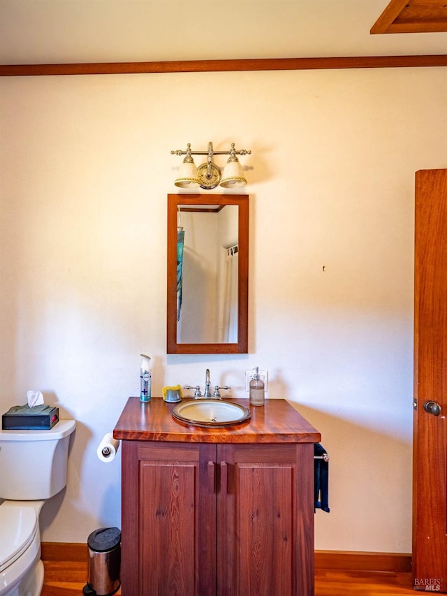 26300 Albion Ridge Rd, Albion, CA 95410 - bathroom featuring baseboards, wood finished floors, toilet, and vanity