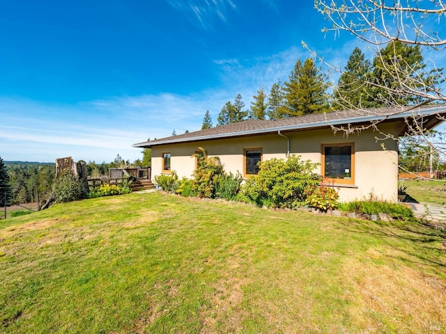 26300 Albion Ridge Rd, Albion, CA 95410 - view of side of home with a wooden deck, stucco siding, and a lawn