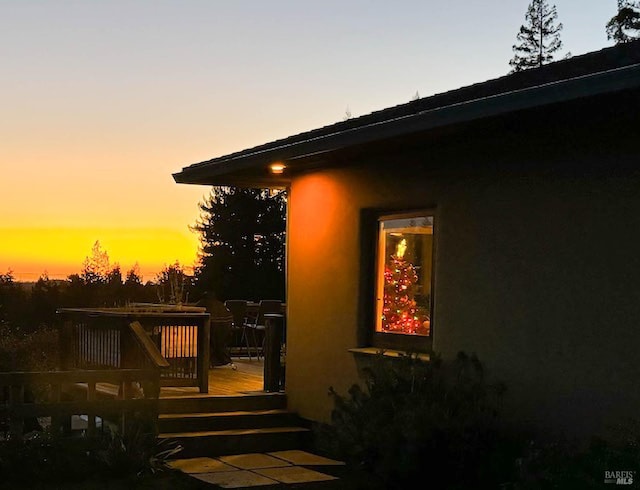26300 Albion Ridge Rd, Albion, CA 95410 - property exterior at dusk with a wooden deck and stucco siding