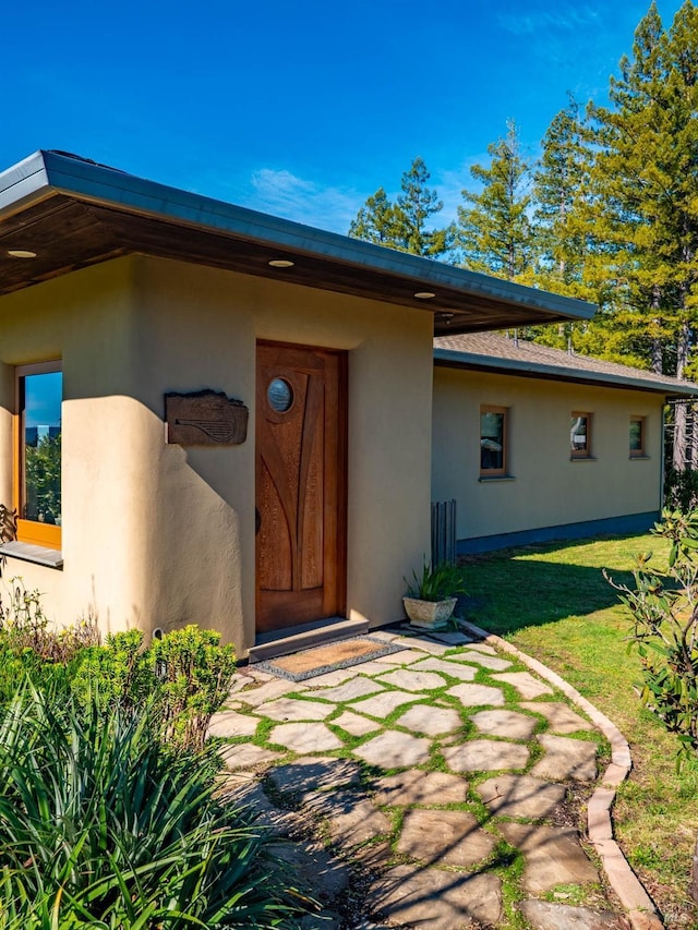 26300 Albion Ridge Rd, Albion, CA 95410 - doorway to property featuring stucco siding and a lawn