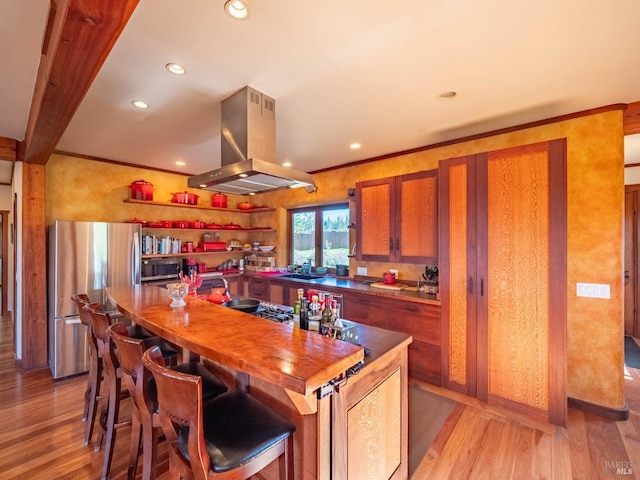 26300 Albion Ridge Rd, Albion, CA 95410 - kitchen featuring recessed lighting, island range hood, light wood-type flooring, freestanding refrigerator, and brown cabinetry