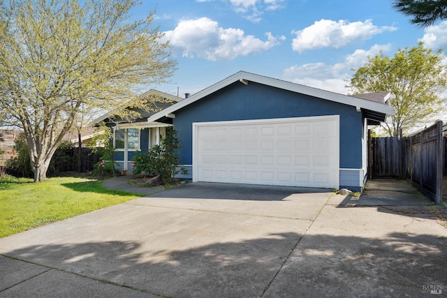 ranch-style house with concrete driveway, fence, a front yard, and stucco siding