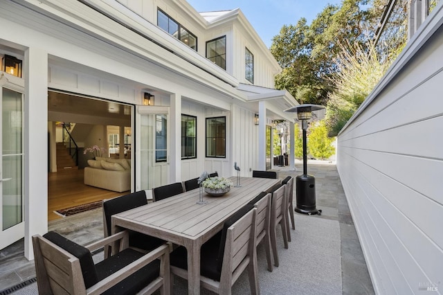 view of patio / terrace featuring outdoor dining area and visible vents