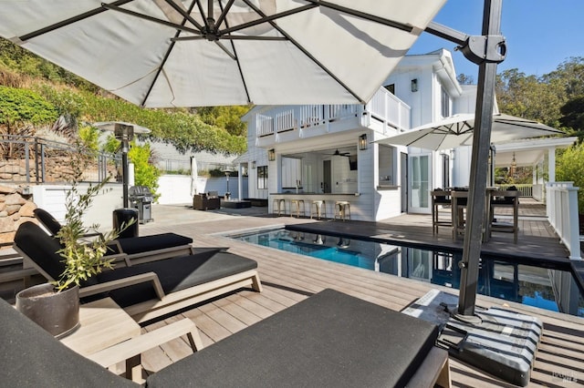 view of swimming pool with fence, area for grilling, a fenced in pool, outdoor dining space, and an outdoor living space