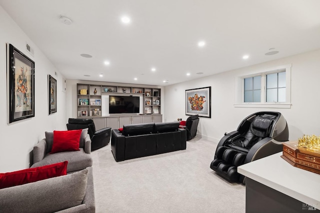living area with light colored carpet, visible vents, recessed lighting, and built in shelves