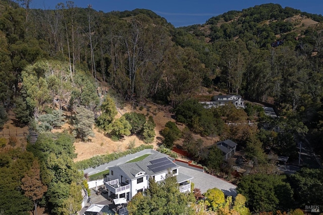 birds eye view of property with a forest view