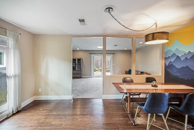 carpeted living area with recessed lighting, visible vents, and baseboards