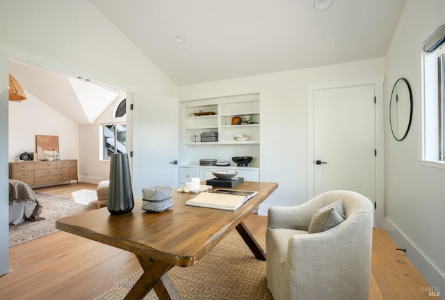 155 Hidden Valley Ln, San Anselmo, CA 94960 - dining room featuring baseboards, vaulted ceiling with skylight, and light wood-type flooring