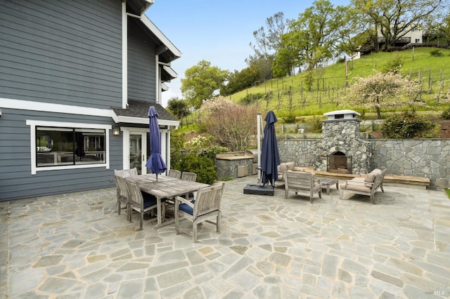 155 Hidden Valley Ln, San Anselmo, CA 94960 - view of patio featuring an outdoor stone fireplace and outdoor dining area