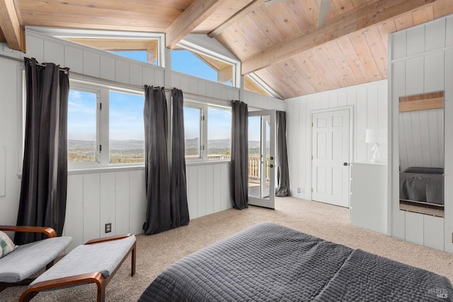 bedroom featuring vaulted ceiling with beams, wood walls, wood ceiling, and carpet