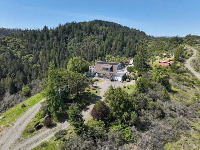 birds eye view of property with a forest view