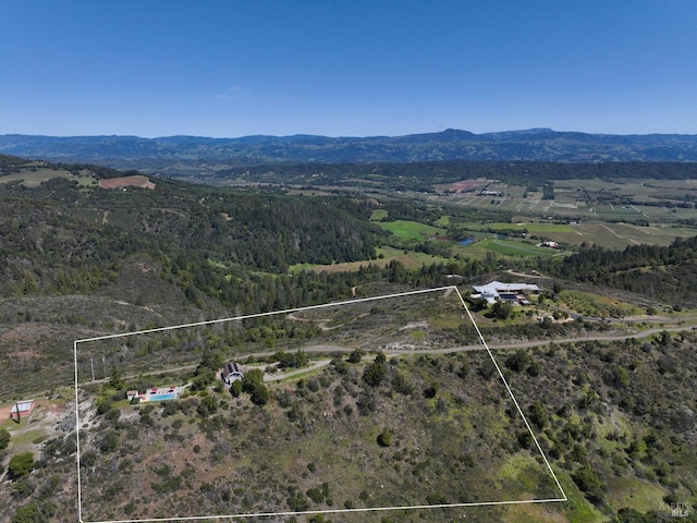 aerial view featuring a mountain view and a rural view