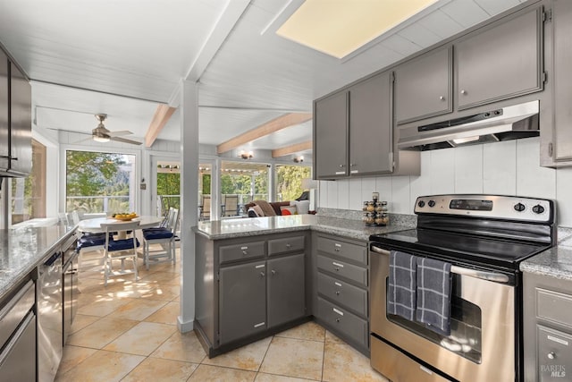 kitchen featuring under cabinet range hood, stainless steel range with electric cooktop, light tile patterned floors, and gray cabinets