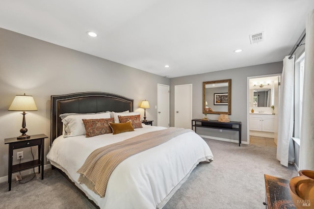 bedroom featuring connected bathroom, baseboards, light colored carpet, visible vents, and recessed lighting