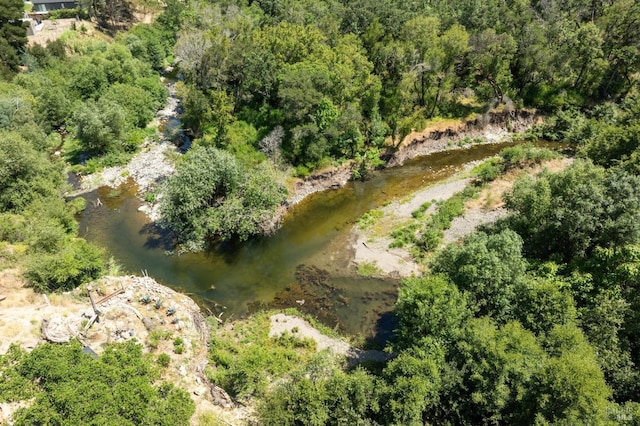 drone / aerial view with a view of trees
