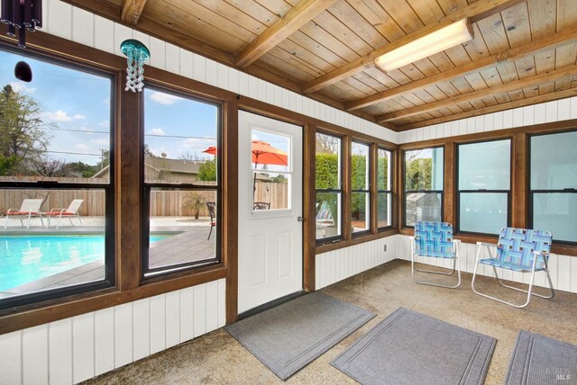 148 Kerns Ct, Napa, CA 94558 - sunroom with carpet flooring, wooden ceiling with exposed beams, and wood walls