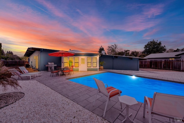 148 Kerns Ct, Napa, CA 94558 - pool at dusk featuring a patio area, a fenced backyard, and a grill