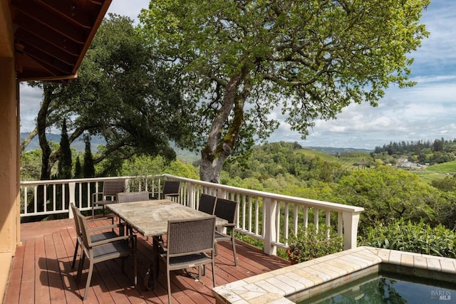 wooden deck featuring outdoor dining space
