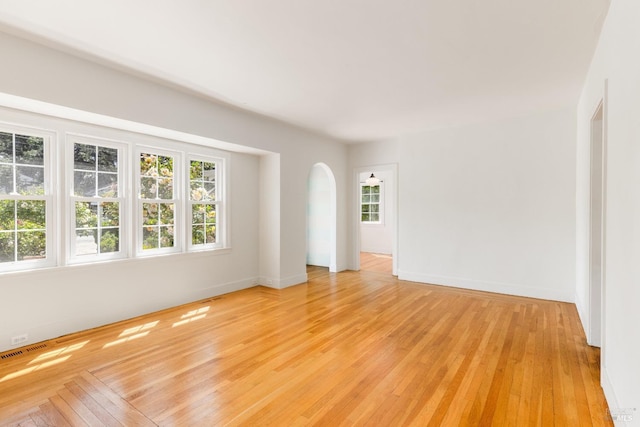 331 1st St, Healdsburg, CA 95448 - spare room with light wood finished floors, arched walkways, baseboards, and plenty of natural light