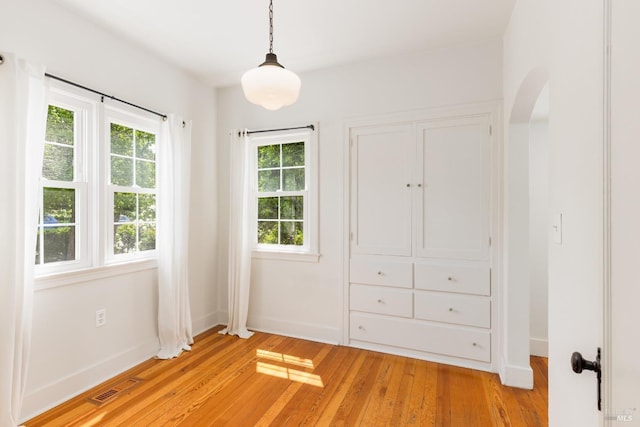 331 1st St, Healdsburg, CA 95448 - interior space with multiple windows, light wood-style floors, visible vents, and baseboards