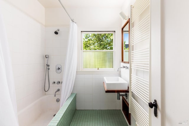331 1st St, Healdsburg, CA 95448 - full bathroom featuring a sink, tile walls, tiled shower / bath combo, radiator heating unit, and tile patterned flooring