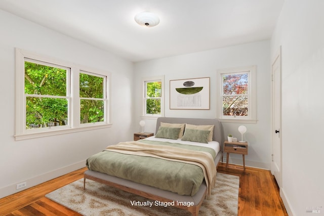 331 1st St, Healdsburg, CA 95448 - bedroom featuring multiple windows, wood finished floors, and baseboards