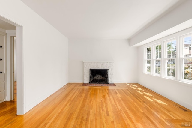 331 1st St, Healdsburg, CA 95448 - unfurnished living room featuring light wood-style floors and a high end fireplace