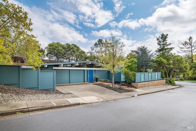 view of front facade with driveway and an attached garage
