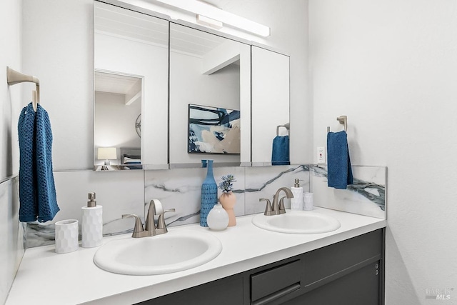 full bathroom featuring double vanity, a sink, and tasteful backsplash