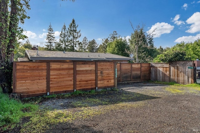 view of outdoor structure featuring fence