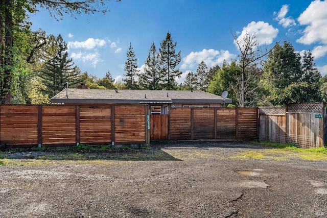 view of outdoor structure with fence