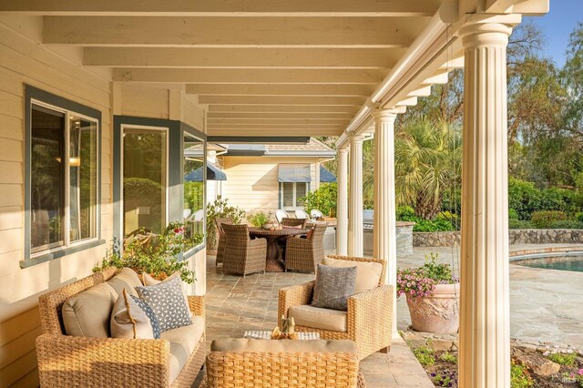 view of patio featuring an outdoor living space and outdoor dining space