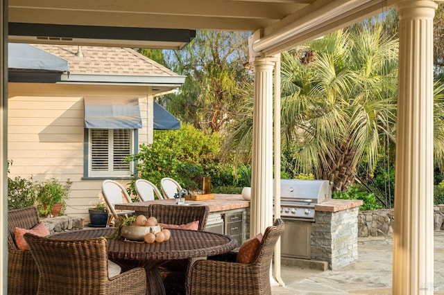 view of patio with grilling area and exterior kitchen