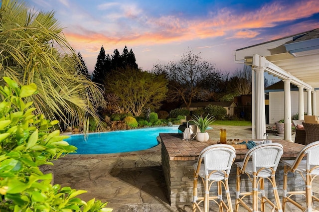 outdoor pool featuring a patio area