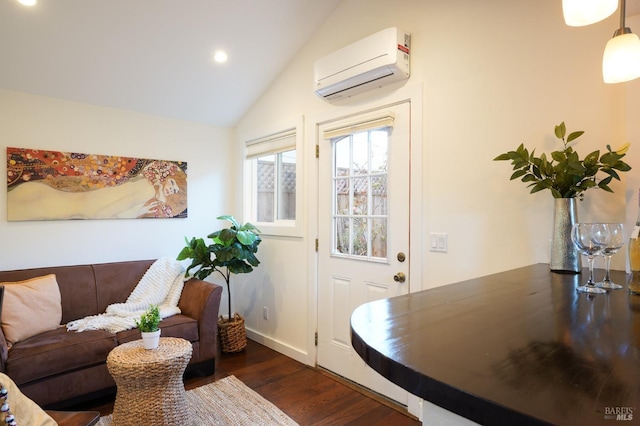 living room with wood finished floors, a wall mounted air conditioner, vaulted ceiling, and recessed lighting