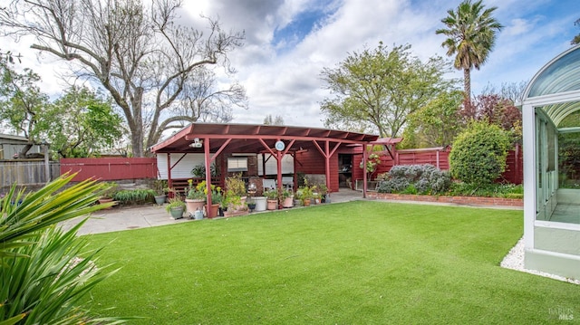 view of yard featuring a gazebo, a patio, and a fenced backyard