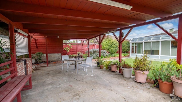 view of patio / terrace featuring fence and outdoor dining space