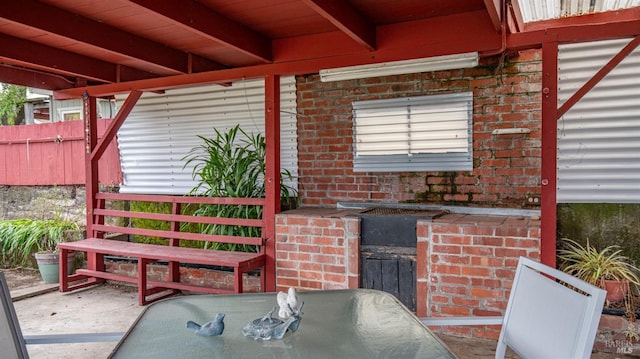 view of patio / terrace with outdoor dining area and fence