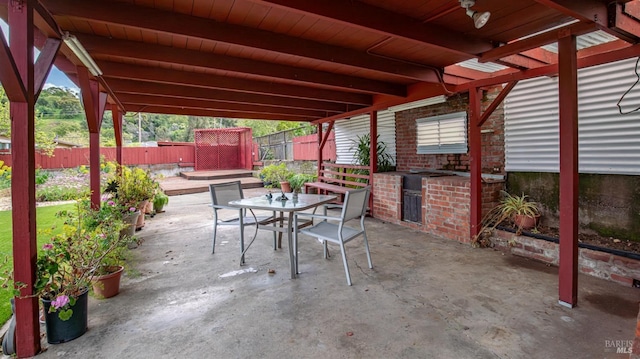 view of patio featuring outdoor dining space and a fenced backyard