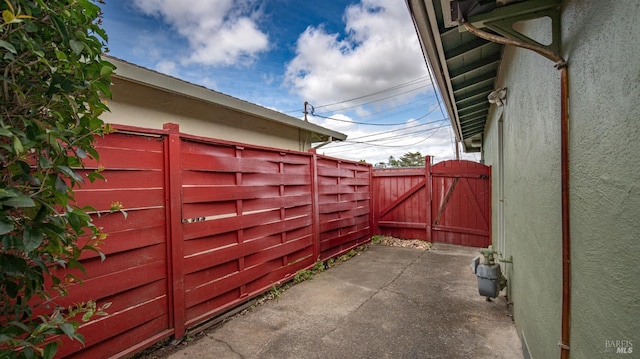 view of patio featuring a gate and fence